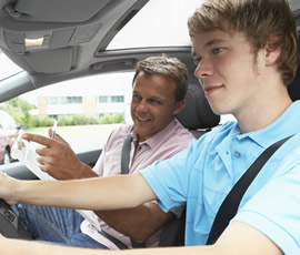 Instructor with a student in the car